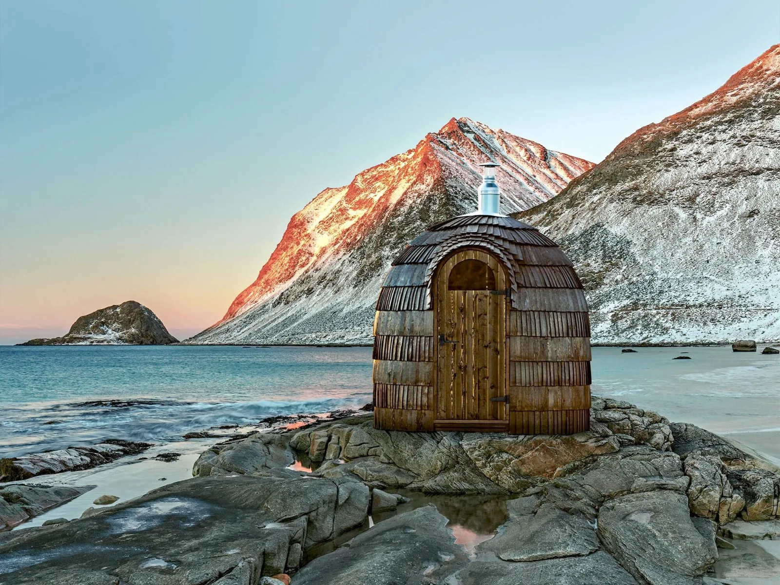 An outdoor sauna pod with a mountain view